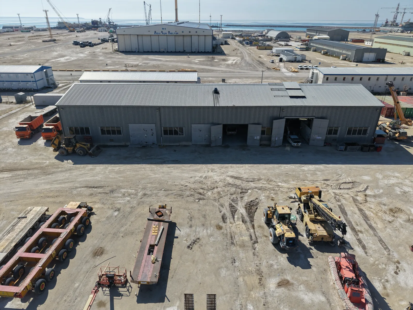 Maintenance Workshop — service bays and yard equipment